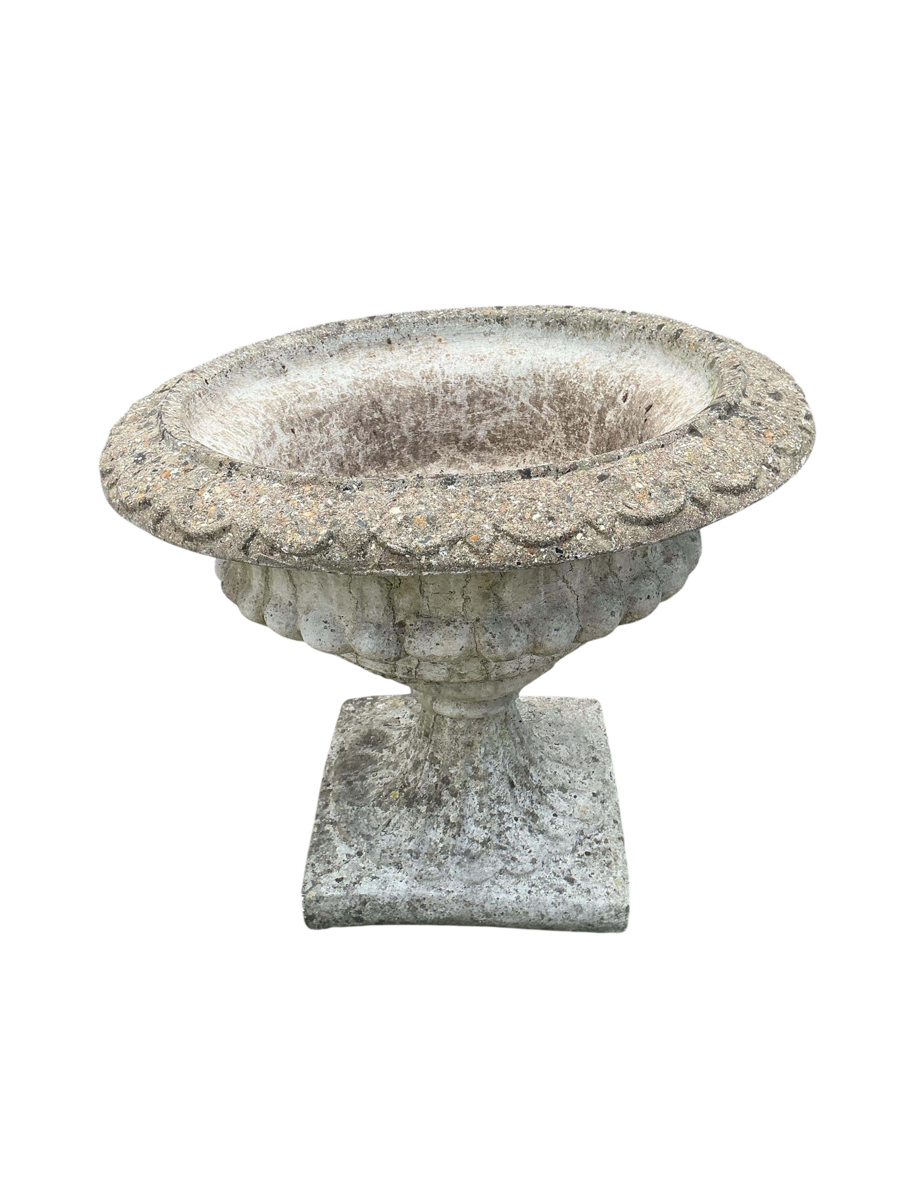 A pair of circular reconstituted stone campana garden urns, diameter 61cm, height 53cm